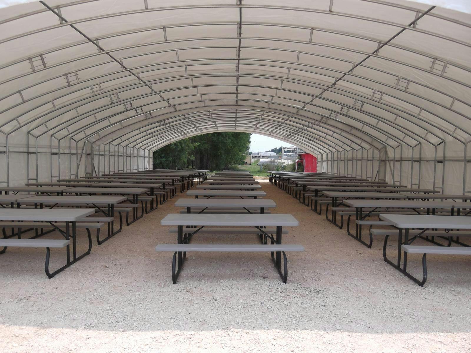 Installed Industrial Fabric Shelter Lunch Tent with Tables.